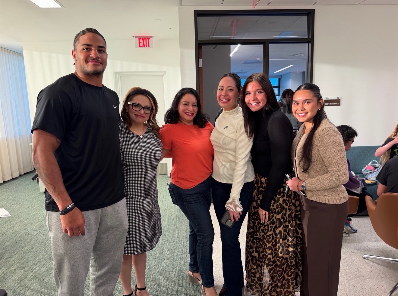 Six attendees pose together during the UIW School of Media and Design open house at Founders Hall.